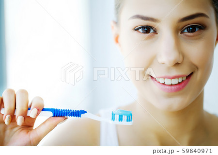Woman With Beautiful Smile, Healthy White Teeth With Toothbrush. High Resolution Image Woman With Beautiful Smile, Healthy White Teeth With Toothbrush. High Resolution Image 59840971