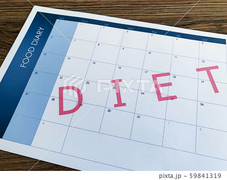 Diet plan concept. Measuring tape and diet plan on wooden background. 59841319