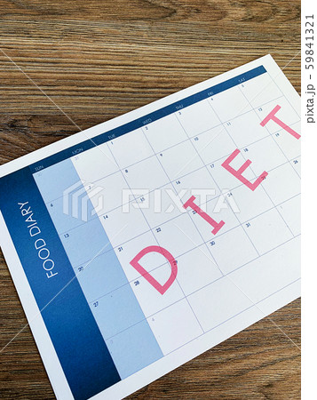 Diet plan concept. Measuring tape and diet plan on wooden background. 59841321
