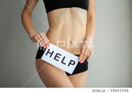 Woman Health Problem. Closeup Of Female With Fit Slim Body In Panties Holding White Card With Word Woman Health Problem. Closeup Of Female With Fit Slim Body In Panties Holding White Card With Word 59842506