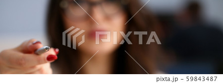 Female arm in suit hold silver pen and pad Female arm in suit hold silver pen and pad 59843487
