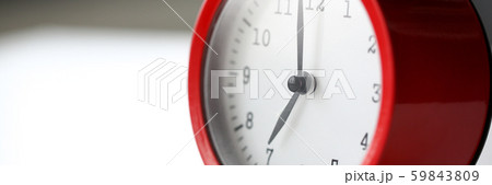 Red alarm clock set at seven in the morning Red alarm clock set at seven in the morning 59843809