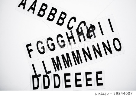 Black capitalize letter on white table background. Black capitalize letter on white table background. 59844007