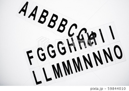 Black capitalize letter on white table background. Black capitalize letter on white table background. 59844010