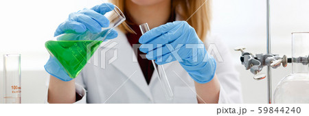 Technician hold in arms in protective gloves Technician hold in arms in protective gloves 59844240