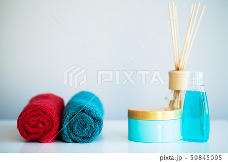 Towels and shower gel on white table with copy space on bath room background. 59845095