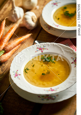 Closeup of delicious home made broth on old wooden table 59847696