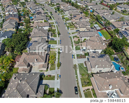 Suburban neighborhood street with big villas Suburban neighborhood street with big villas 59848015