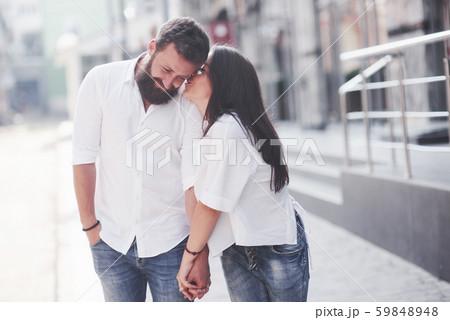 Beautiful happy couple hugging on the city street.Lifestyle concept love and romance Beautiful happy couple hugging on the city street.Lifestyle concept love and romance 59848948