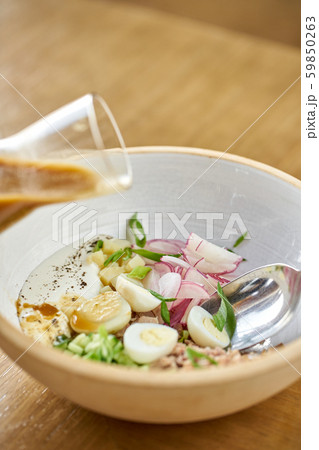 Soup okroshka. Traditional Russian summer cold dish with kvass in bowl on wooden background Soup okroshka. Traditional Russian summer cold dish with kvass in bowl on wooden background 59850263