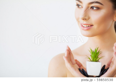 Skin Care. Beauty Woman Face With Healthy Skin And Green Plant 59850530