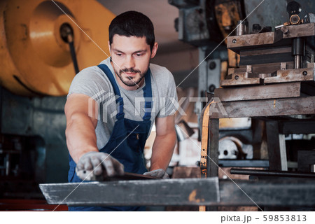 Experienced operator in a hard hat. Metalworking industry concept professional engineer metalworker Experienced operator in a hard hat. Metalworking industry concept professional engineer metalworker 59853813