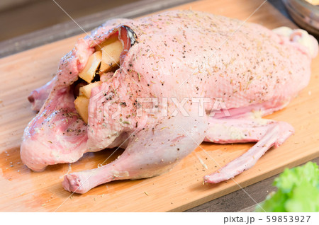 Close-up of preparing duck or goose for baking. White carrot dressing with mayonnaise. Christmas 59853927