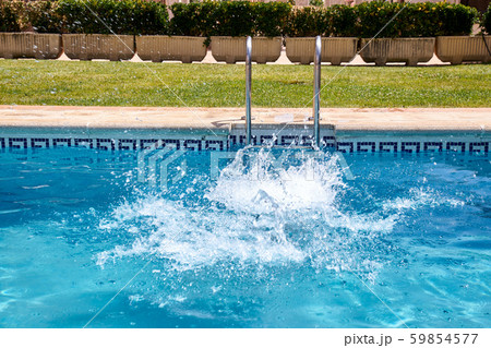 woman swimming in a pool woman swimming in a pool 59854577