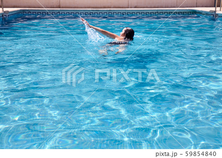 woman swimming in a pool 59854840