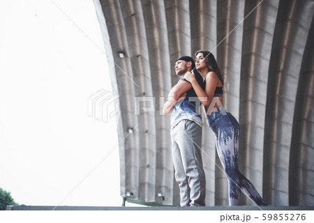 Young athletes are a couple of women and men outdoors 59855276