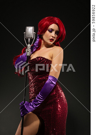Young redhead woman retro style singer. Vintage 59856922