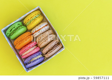 french multi-colored cookies makoorons on a yellow 59857111