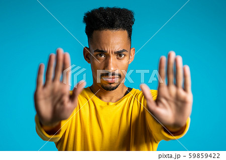No, never, handsome african man disliking and rejecting gesture by stop sign 59859422