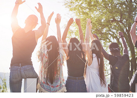 Happy friends have fun on the beach - Young people playing in open air water on summer holidays 59859423