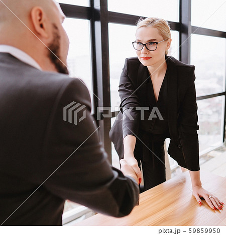 Business partners shaking hands, sealing a deal Business partners shaking hands, sealing a deal 59859950