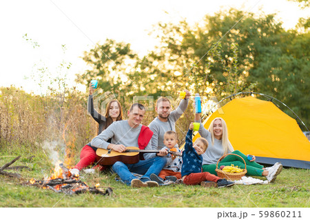 travel, tourism, hike, picnic and people concept - 59860211