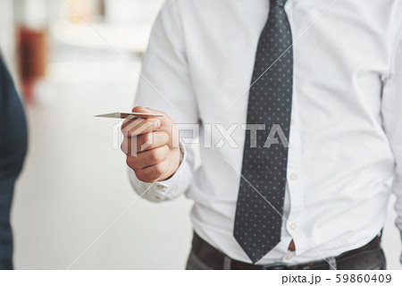 plastic card in the hands of a man plastic card in the hands of a man 59860409