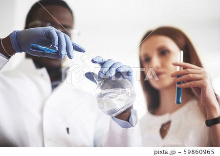 Experiments in the chemical laboratory. An experiment was carried out in a laboratory in transparent Experiments in the chemical laboratory. An experiment was carried out in a laboratory in transparent 59860965