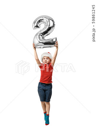 Silver inflatable number 2 in the hands of a 59861245