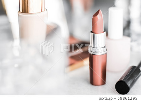 Cosmetics, makeup products on dressing vanity 59861295