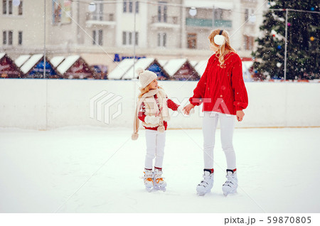 Cute and beautiful family in a winter city Cute and beautiful family in a winter city 59870805