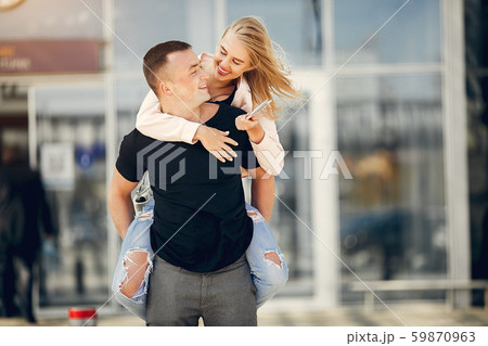 Beautiful couple standing in a airport 59870963