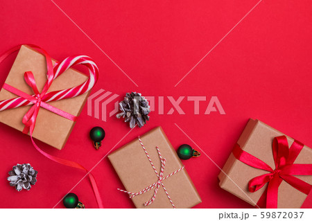 Christmas flat lay with gift boxes and pine cones Christmas flat lay with gift boxes and pine cones 59872037