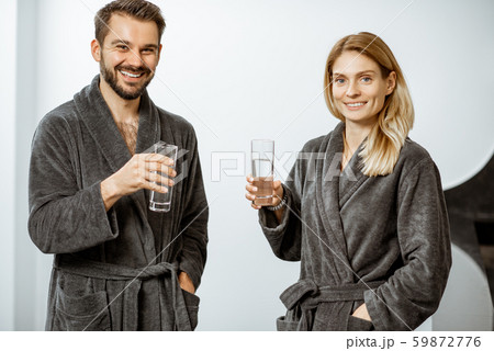Man and woman with mineral water at the pump-room 59872776