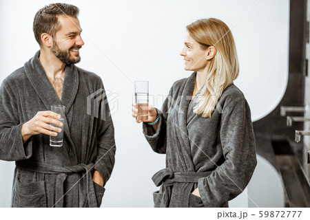 Man and woman with mineral water at the pump-room 59872777