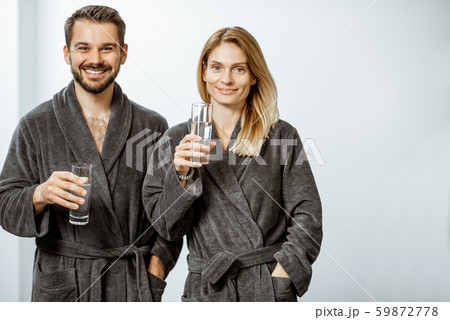 Man and woman with mineral water at the pump-room Man and woman with mineral water at the pump-room 59872778