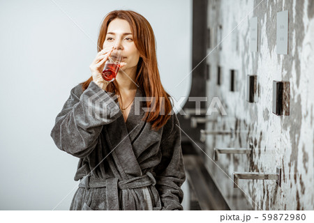 Woman drinking mineral water at the pump-room 59872980
