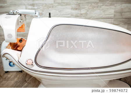 Woman in the spa capsule at the beauty salon Woman in the spa capsule at the beauty salon 59874072