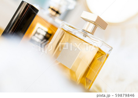Two bottles of perfume with blank labels and luxurious beauty accessories 59879846
