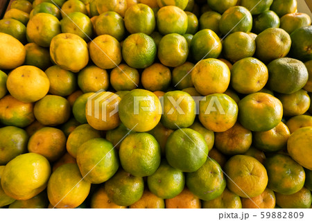 orange fruit stacked on the marketplace 59882809