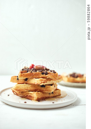 Homemade waffles with fruit and granola. 59882864
