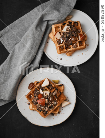 Homemade waffles with fruit and granola. Homemade waffles with fruit and granola. 59882890
