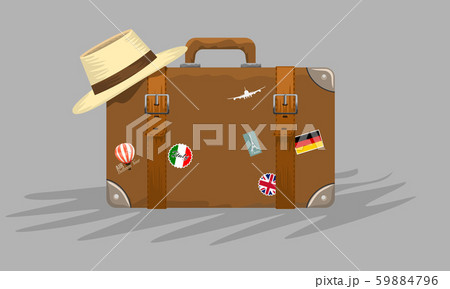Vintage suitcase with stickers and summer hat on it for your travel concept advertisement design Vintage suitcase with stickers and summer hat on it for your travel concept advertisement design 59884796
