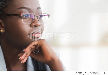 Closeup portrait of confident black businesswoman in glasses Closeup portrait of confident black businesswoman in glasses 59885801