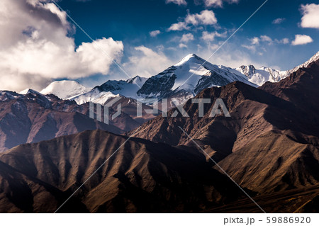 Aerial view of Snow Mountain and light of sunrise on the top himalaya mountains from the plane Aerial view of Snow Mountain and light of sunrise on the top himalaya mountains from the plane 59886920