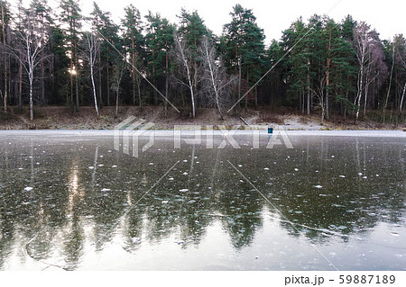 Winter landscape. Frozen forest lake in the Winter landscape. Frozen forest lake in the 59887189