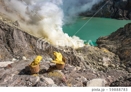 Baskets of sulfur at Kawah Ijen volcano, Java, Indonesia 59888783