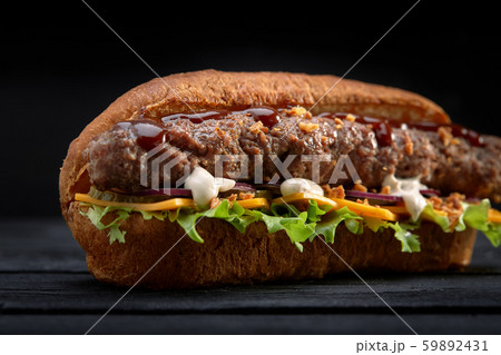 close up of kebab sandwich on black wooden background 59892431