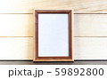 Vertical Dark Brown Picture Frame on Wooden Planks 59892800