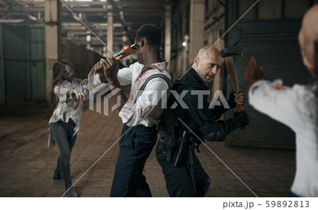 Frightened people fights with zombie army 59892813